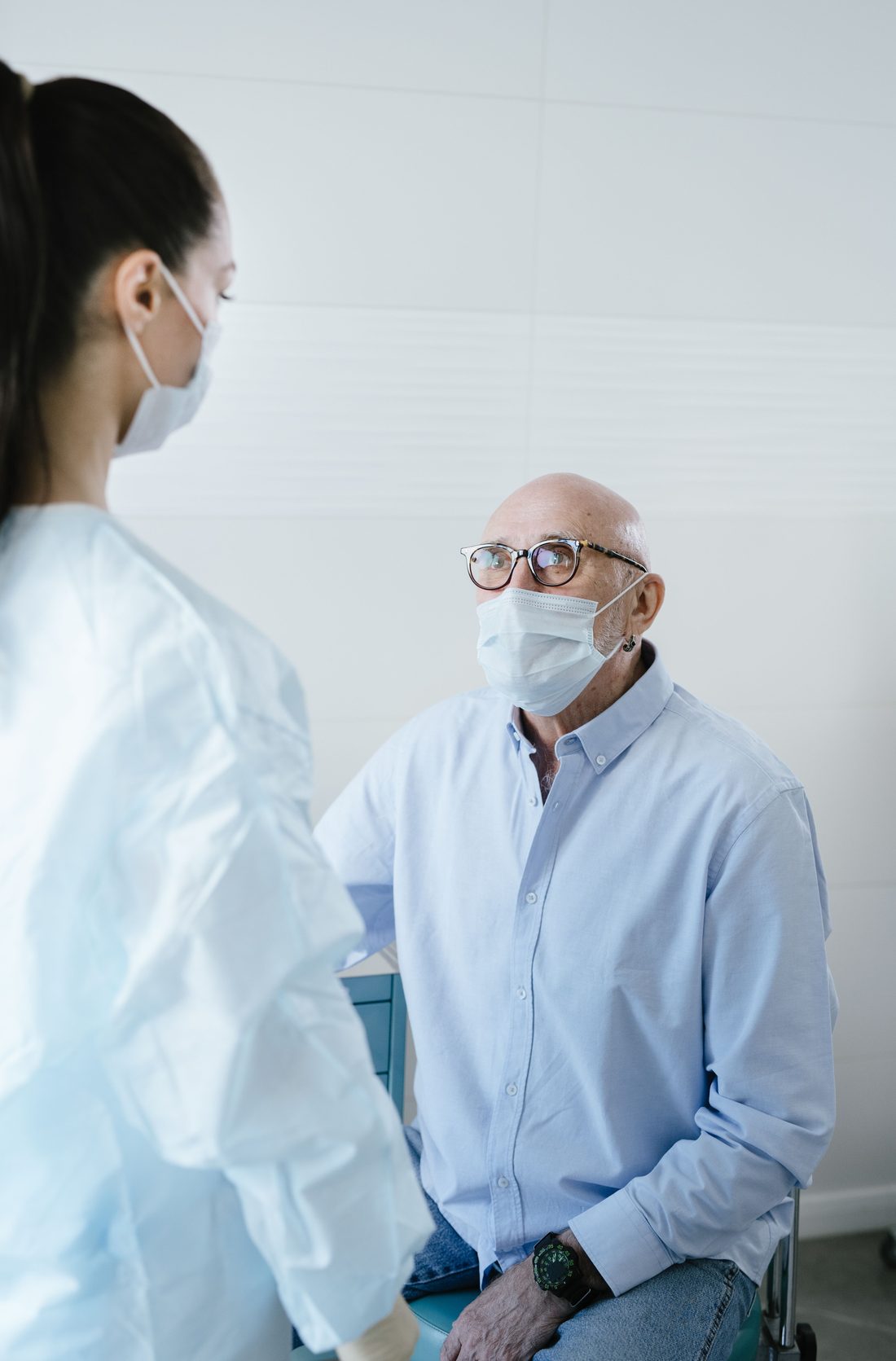 A coordinator accompanying an older person to a clinic appointment